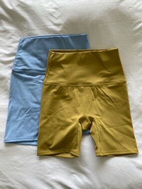 2 pack stretchy workout biker shorts. BRAND NEW. baby blue, mustard.